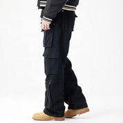 Black cargo pants with multiple flap pockets and panel detailing