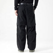 Black cargo pants with panel detailing and side chain