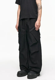 Black wide-leg cargo pants with side flap pockets