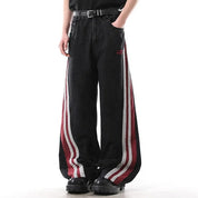 Black wide-leg jeans with red and white side stripe panels
