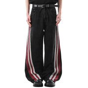 Black wide-leg jeans with red and white side stripe panels