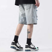 Light blue distressed denim shorts with ripped detailing