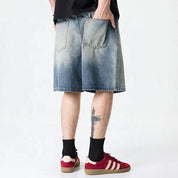 Light blue washed denim shorts with gradient fade
