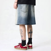 Light blue washed denim shorts with gradient fade